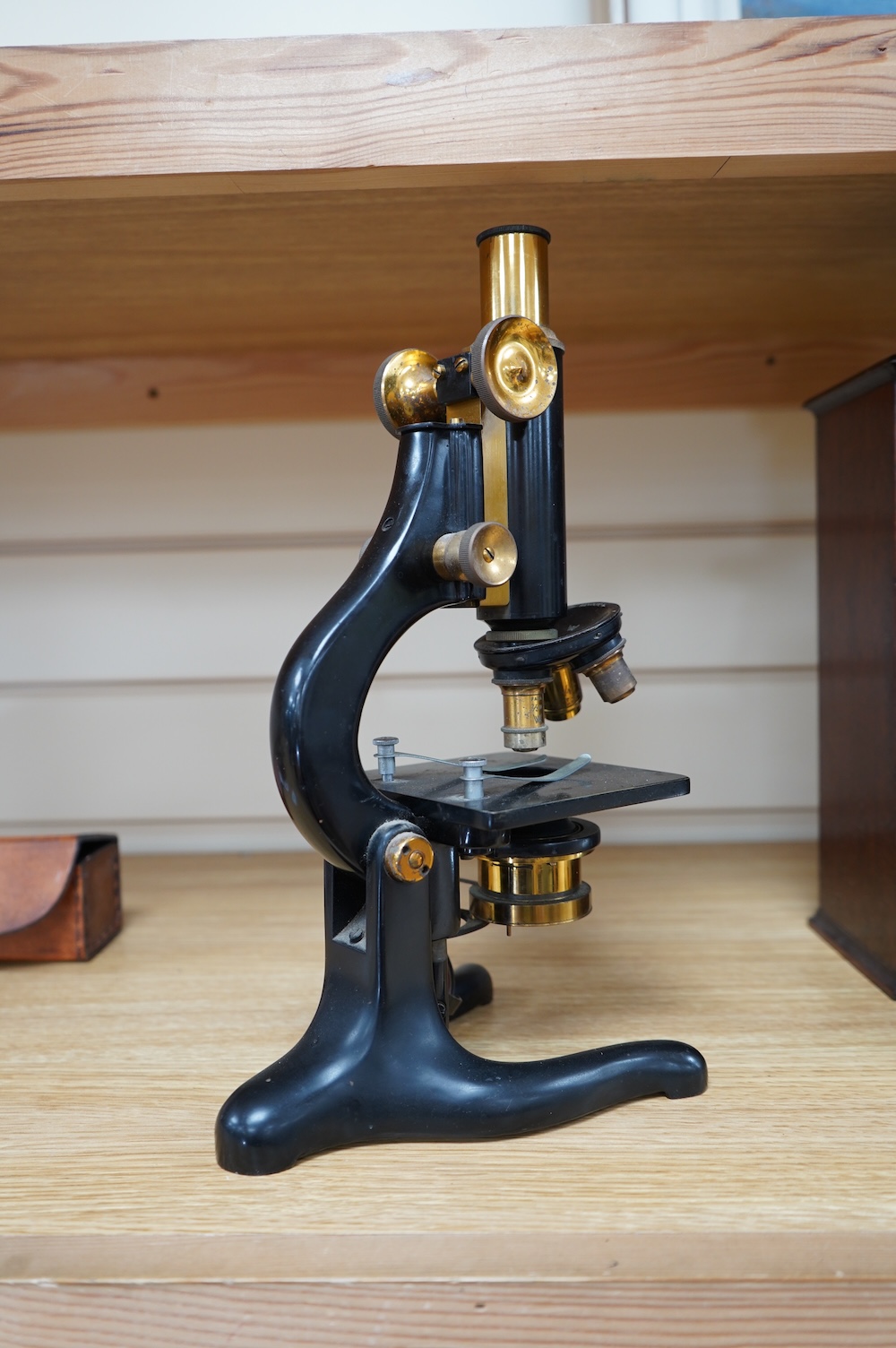 An early 20th century monocular brass microscope by W. Watson & Sons, 31cm high. Condition - fair to good.